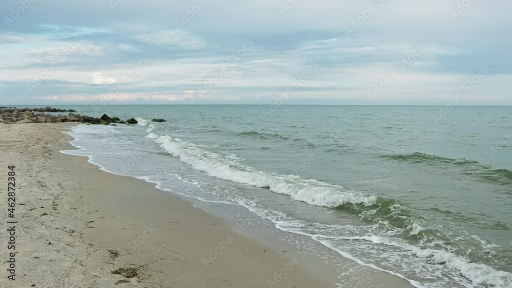 Ocean landscape. Beach waves. Summer vacation. Panoramic scenic view of evening sea horizon with tide cloudy blue sky nature background. Ocean landscape. Beach waves. Summer vacation. Panoramic scenic view of evening sea horizon with tide cloudy blue sky nature background.