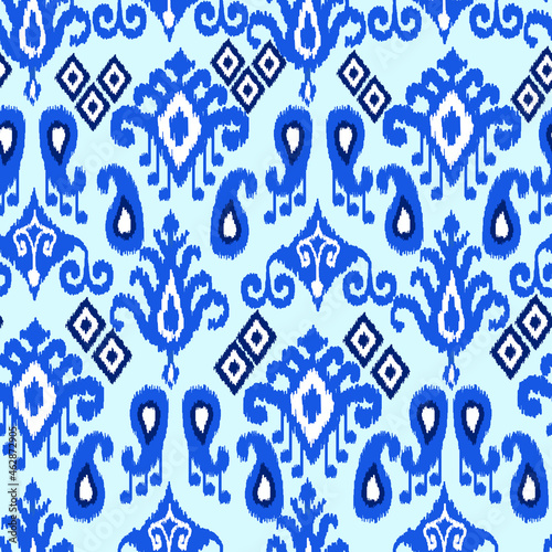 Blue color ikat pattern - traditional handmade silk fabric, producing in Margilan city, Uzbekistan. Oriental ornaments. Ferghana valley. Adras and atlas