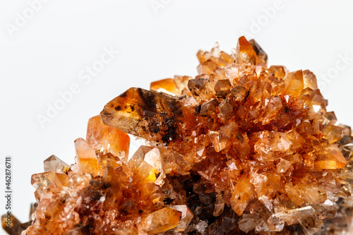 Macro of mineral stone Creedite on microcline on white background photo