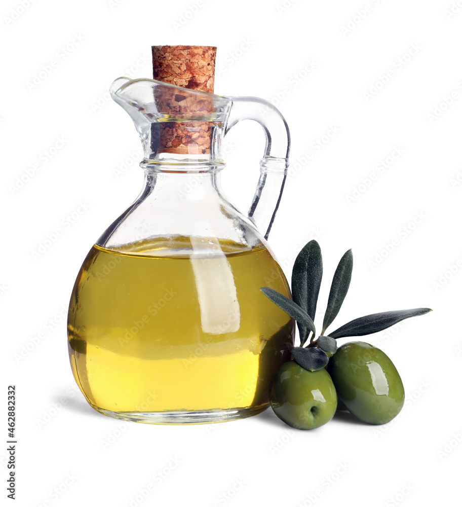 Glass jug of oil, ripe olives and leaves on white background Glass jug of oil, ripe olives and leaves on white background