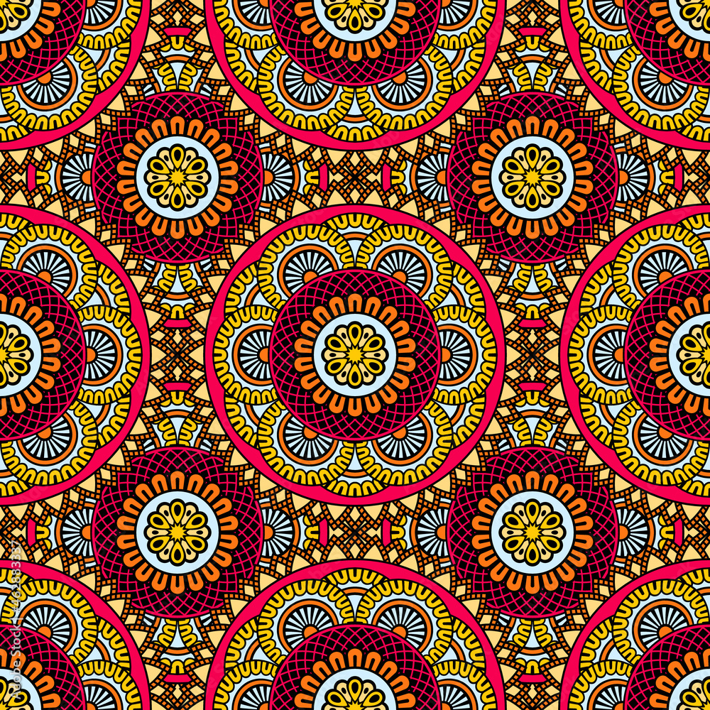 Abstract seamless backdrop. Round colorful texture in red and orange colors. Mandala background. Oriental pattern for design