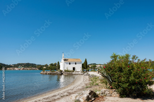 The small and picturesque Hypapante church in Gouvia, Corfu, Greece photo
