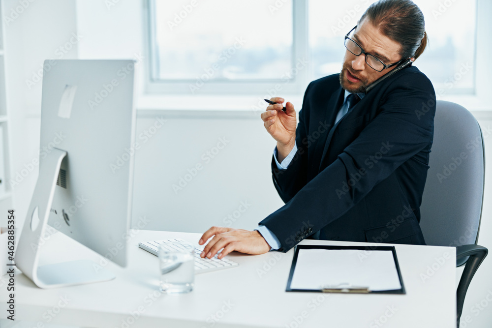male manager emotions work head documents computer