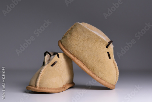 Fototapeta Naklejka Na Ścianę i Meble -  Little baby shoes. Fashionable modern baby shoes. Concept of care, baby, motherhood.