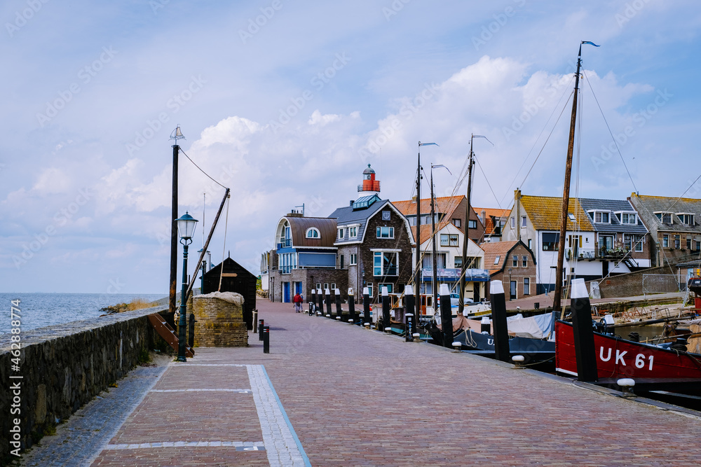 old harbor of the fishing village Urk in Flevoland Netherlands, beautiful Spring day at the former Island of Urk Holland Europe May 2021 - obrazy, fototapety, plakaty 