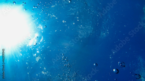 View of Air Bubbles underwater. Blue water and sun. Adriatic Sea 