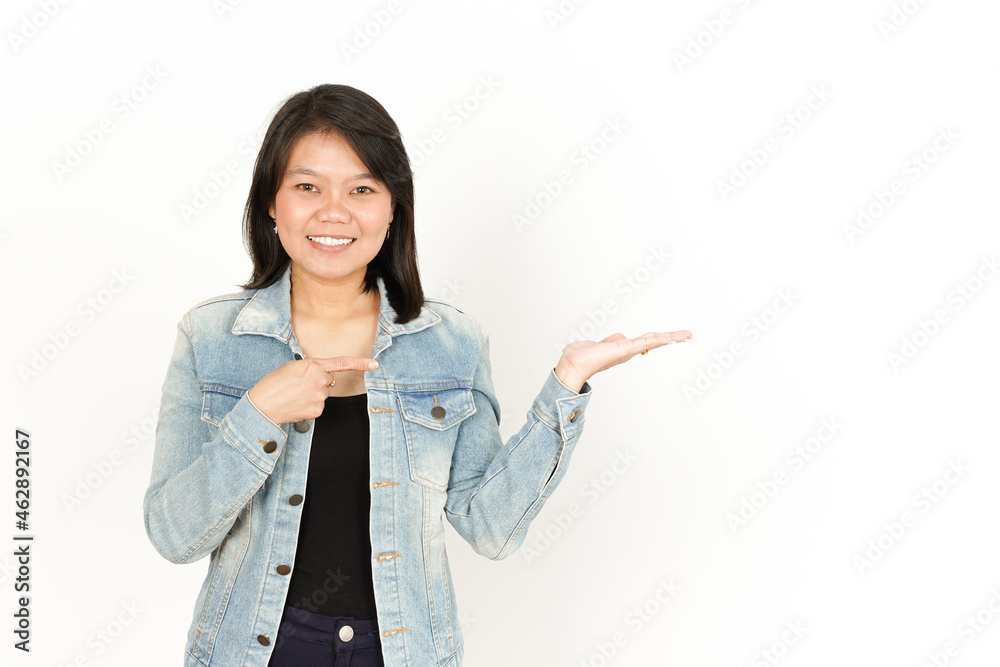 Showing and Presenting Product On Open Palm of Beautiful Asian Woman Wearing Jeans Jacket and black shirt Isolated On White Background Showing and Presenting Product On Open Palm of Beautiful Asian Woman Wearing Jeans Jacket and black shirt Isolated On White Background