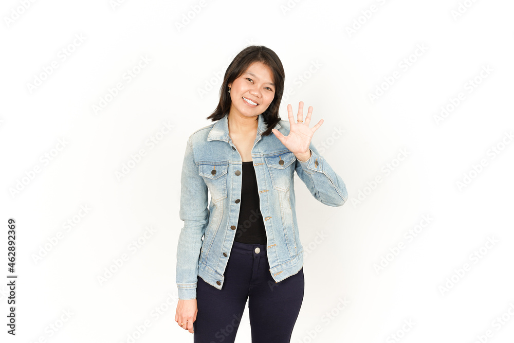 Waving Hand Greeting of Beautiful Asian Woman Wearing Jeans Jacket and black shirt Isolated On White Background Waving Hand Greeting of Beautiful Asian Woman Wearing Jeans Jacket and black shirt Isolated On White Background