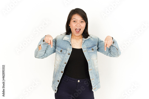 Pointing Down and Presenting of Beautiful Asian Woman Wearing Jeans Jacket and black shirt Isolated On White Background