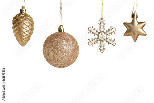 Golden Christmas toys isolated on white background