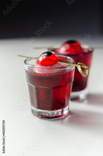 Scary drinks shots made with tequila, grenadine and tabasco decorated with jelly eyeball