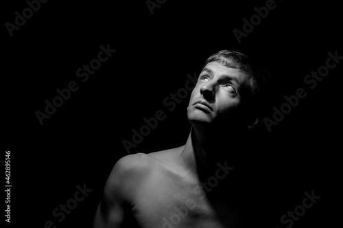 black and white dramatic photo of a man