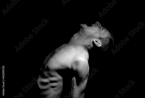 Εκτύπωση καμβά emotional photo, man shouting on black background