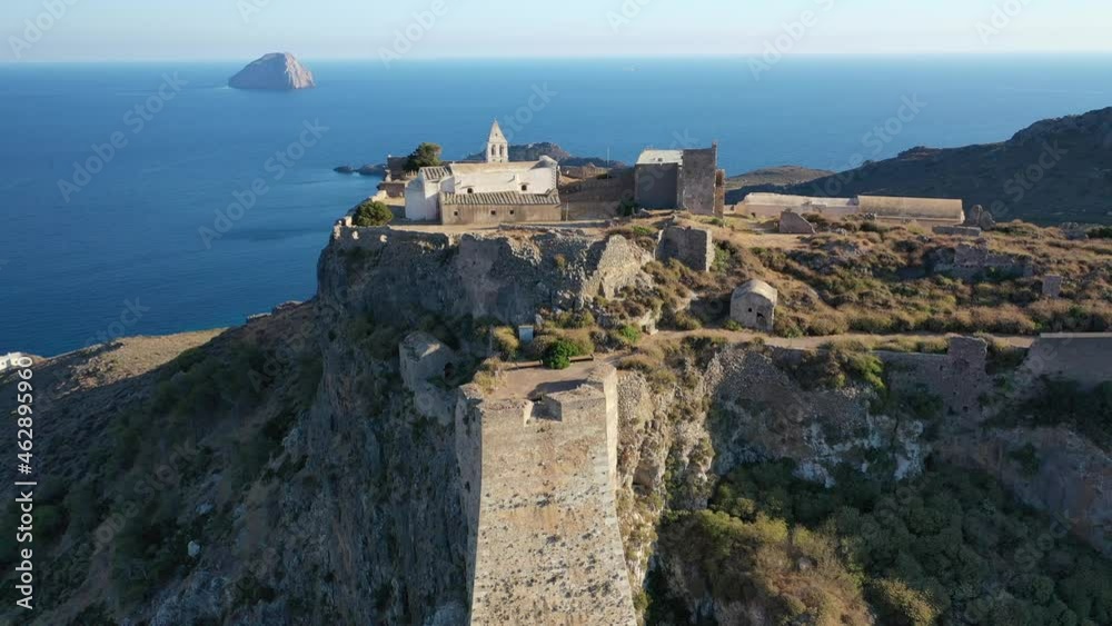 Aerial drone video of iconic medieval castle of main village of Kithira island overlooking beautiful double bay and beach of Kapsali, Kythira island, Ionian, Greece Aerial drone video of iconic medieval castle of main village of Kithira island overlooking beautiful double bay and beach of Kapsali, Kythira island, Ionian, Greece