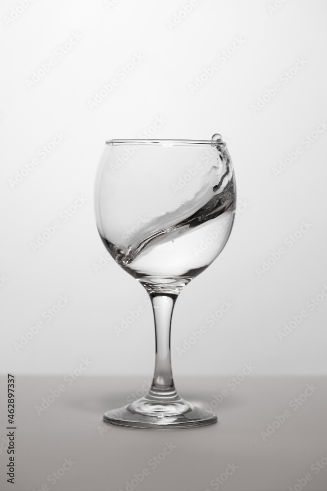 Wineglass with white wine with splash Wineglass with white wine with splash