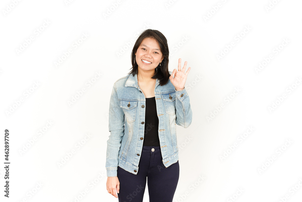 Showing Ok Sign of Beautiful Asian Woman Wearing Jeans Jacket and black shirt Isolated On White Background Showing Ok Sign of Beautiful Asian Woman Wearing Jeans Jacket and black shirt Isolated On White Background