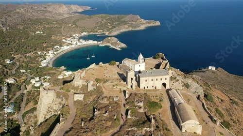 Aerial drone video of iconic medieval castle of main village of Kithira island overlooking beautiful double bay and beach of Kapsali, Kythira island, Ionian, Greece photo
