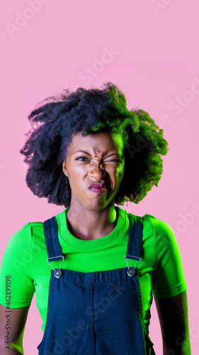 Young black woman isolated grimacing displeased and confused