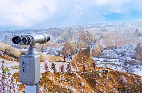 The coin-operated binoculars help to watch area in dertails, Pigeon Valley, Cappadocia, Turkey photo