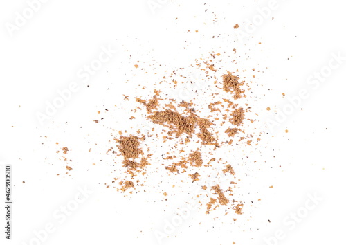 Close up pile ground, milled nutmeg powder isolated on white background, top view 