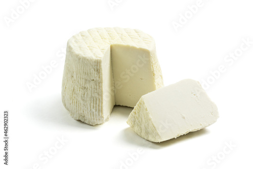 Ricotta salata cheese with slice isolated on white background photo