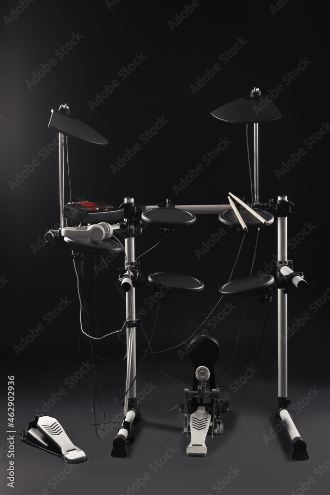Modern electronic drum kit on dark background. Musical instrument Modern electronic drum kit on dark background. Musical instrument