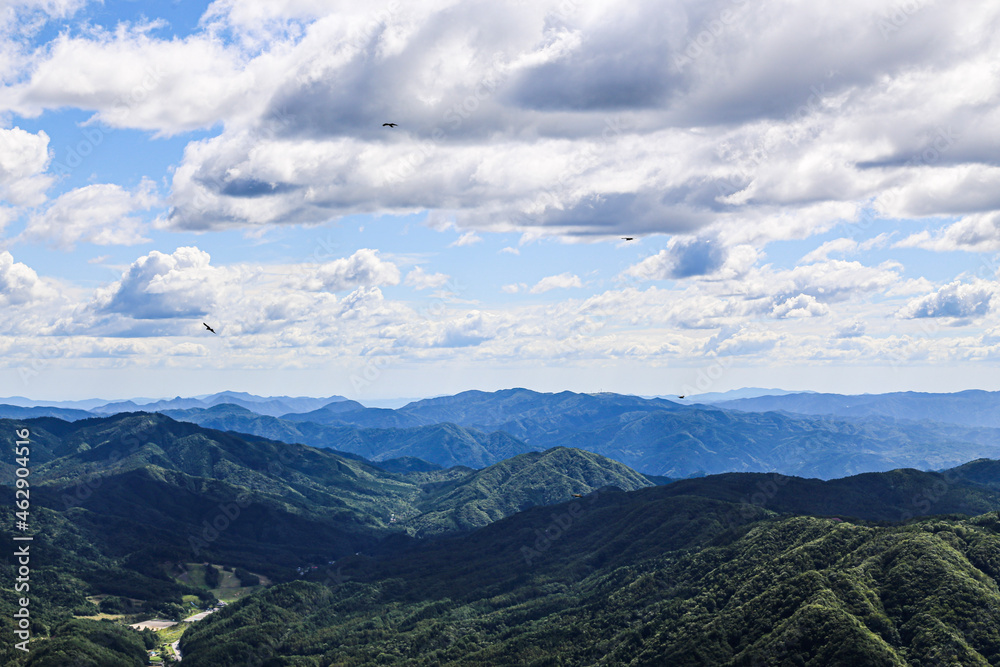 Clouds over mountains with kites Clouds over mountains with kites