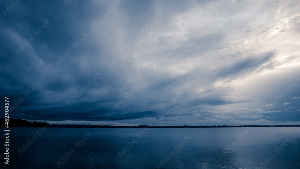 Blue sky and lake. Blue sky and clouds over lake horizon background with smooth wave water 