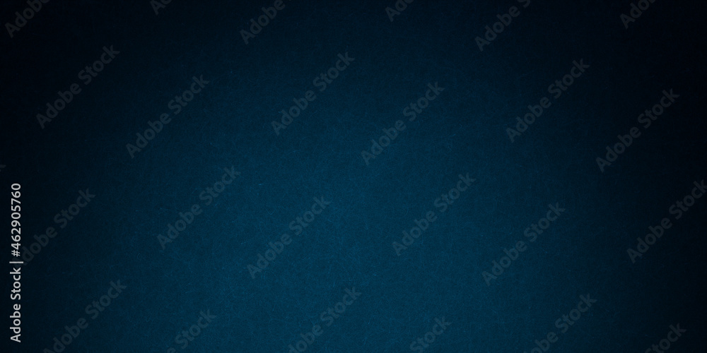 Dark blue background texture with black vignette in old vintage grunge textured border design, dark elegant teal color wall with light spotlight center