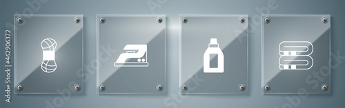 Set Towel stack, Bottle for cleaning agent, Electric iron and Yarn. Square glass panels. Vector