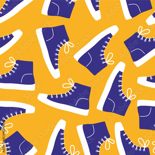 Shoe pair, boots, footwear. Canvas shoes. Сolor seamless pattern on yellow background. Doodle. Fashion old style high-top and low-top sneakers. Lace-up shoes. Color flat vector illustration. Isolated.