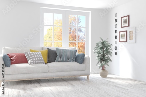 Wallpaper Mural Stylish room in white color with sofa and autumn landscape in window. Scandinavian interior design. 3D illustration Torontodigital.ca