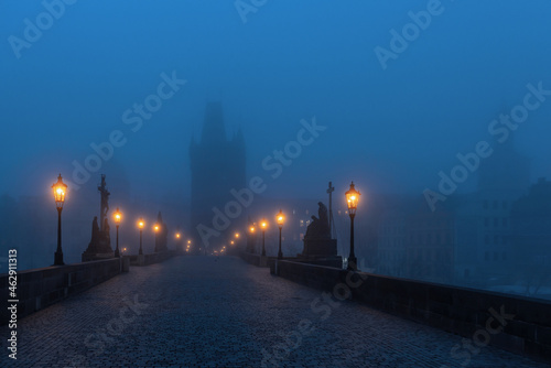 Foggy morning twilight on the famous Charles Bridges in the Czech Republic - the city of Prague