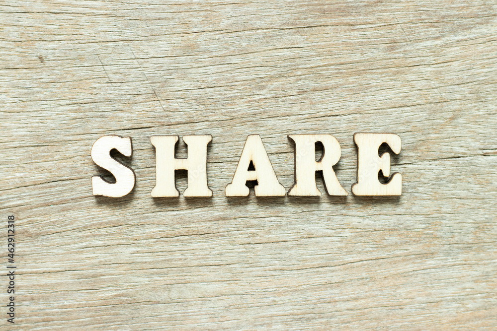 Alphabet letter in word share on wood background Alphabet letter in word share on wood background