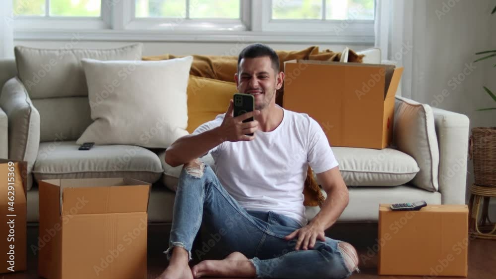 Man checking parcel box with phone and calculator.Concept online seiling. Man checking parcel box with phone and calculator.Concept online seiling.