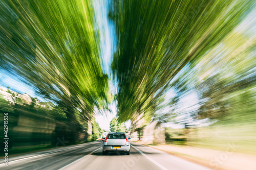 Speeding Car On A Highway, Country Asphalt Road. Motion Blur Background © Grigory Bruev