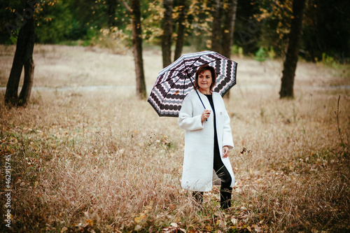 girl with umbrella in the woods