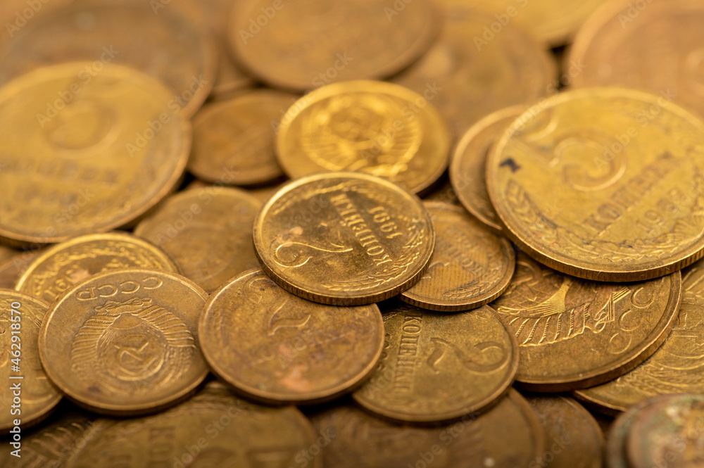 Old coins out of circulation in bulk, background image, close-up, selective focus. Old coins out of circulation in bulk, background image, close-up, selective focus.