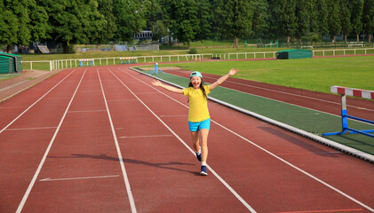 Little girl have fun on the stadium