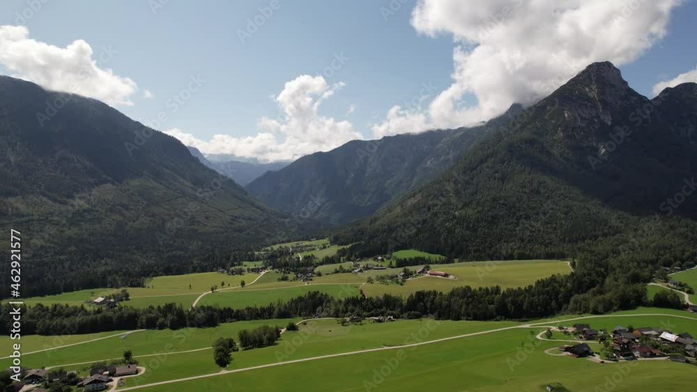 Aerial view of the village, green fields and forest in mountains Alps Austria, travel and nature concept Aerial view of the village, green fields and forest in mountains Alps Austria, travel and nature concept