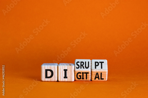 Digital or disrupt symbol. Turned cubes and changed the word 'digital' to 'disrupt'. Beautiful orange background. Business digital or disrupt concept. Copy space.