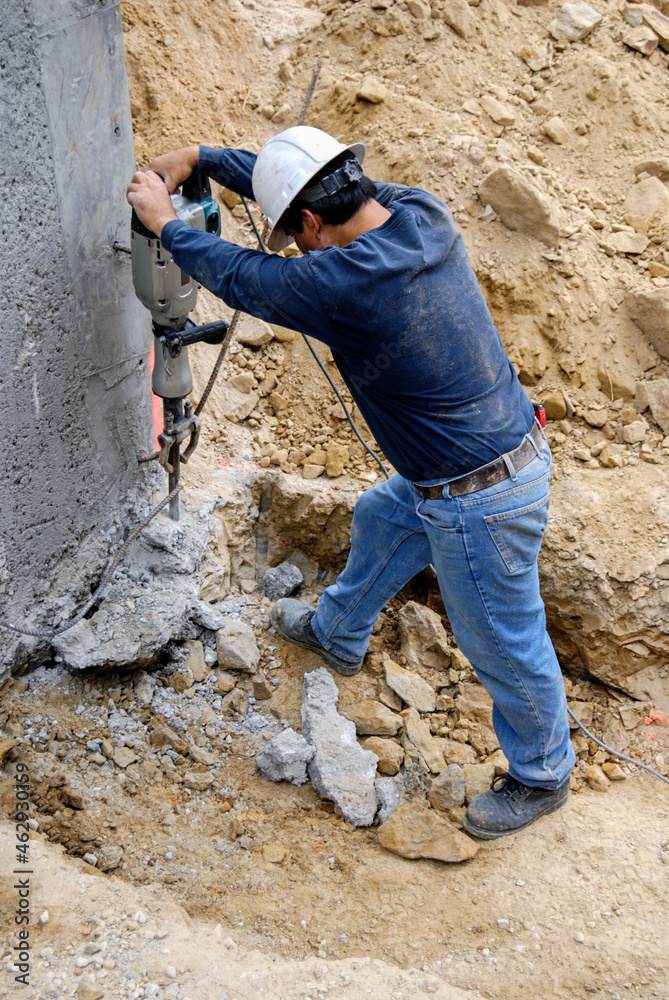Using a jackhammer to remove excess concrete Using a jackhammer to remove excess concrete