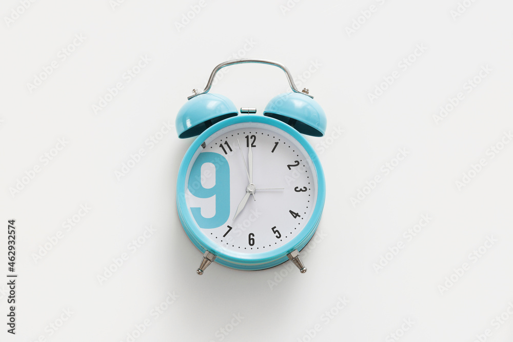 Blue alarm clock on the white background. Morning, time to wake up. Blue alarm clock on the white background. Morning, time to wake up.