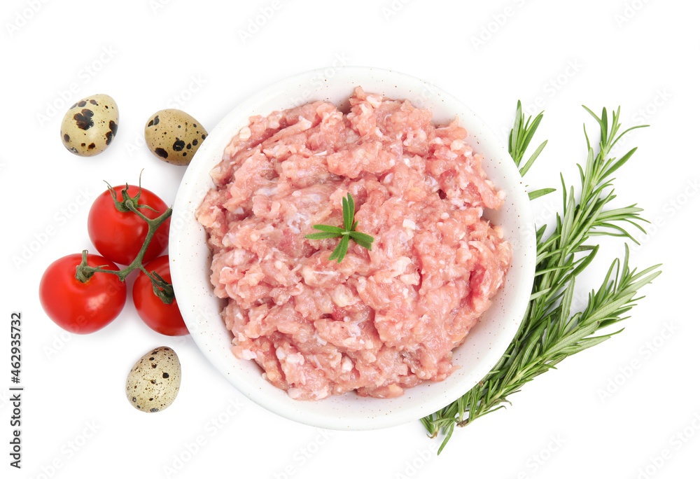 Raw chicken minced meat with rosemary, quail eggs and tomatoes on white background, top view Raw chicken minced meat with rosemary, quail eggs and tomatoes on white background, top view