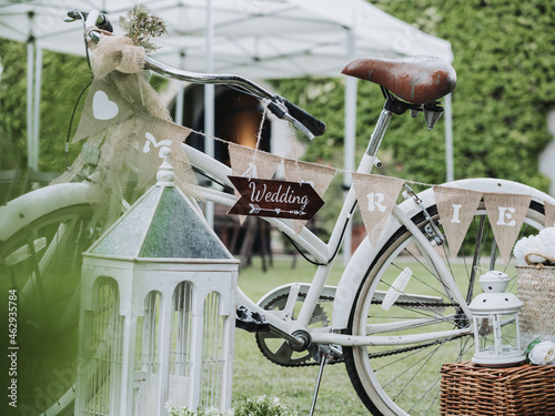 White wedding bicycle decoration with a green background