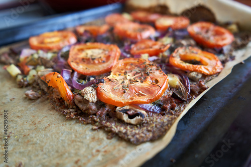 Pizza made from flaxseed meat and vegetables. Dairy-free, gluten-free. 
