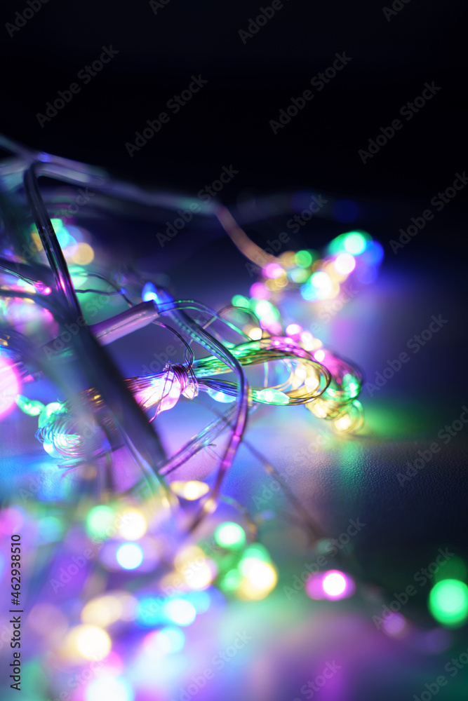 Lights of a lit new year garland at night Lights of a lit new year garland at night