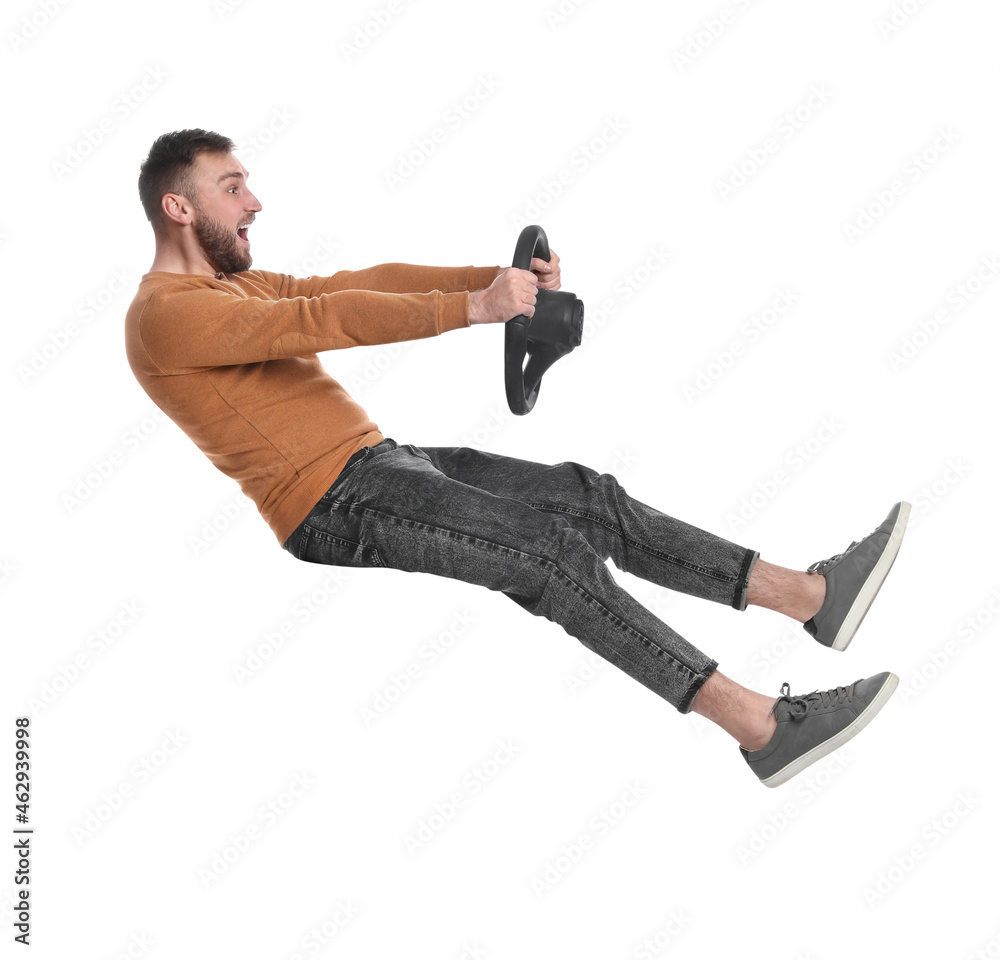 Emotional man with steering wheel against white background Emotional man with steering wheel against white background