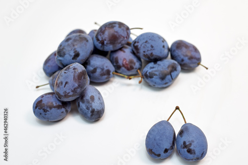 ripe plum on white background