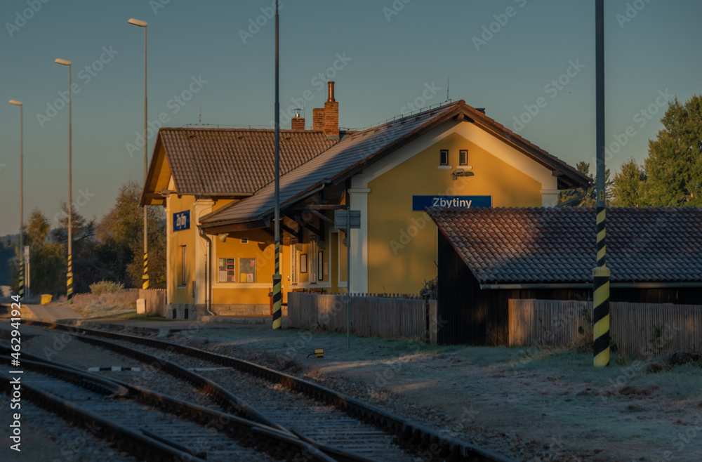 Zbytiny station with blue sky and sunrise light in Sumava autumn mountains